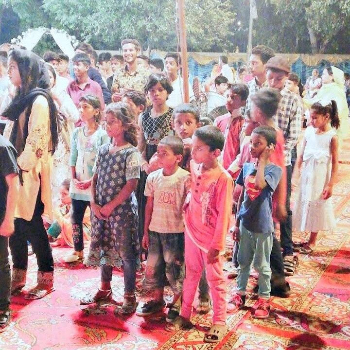 Children and young people gathered at a BrightColoursOrphanage community event
